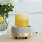 The Midas wax melt warmer is shown with a 10 oz. candle on its bottom warming plate